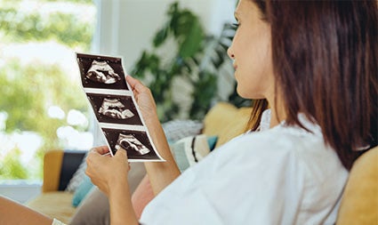 Woman reviewing sonogram image